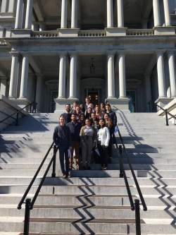 Sixteen Princeton students on the steps of the Eisenhower Executive Office Building.