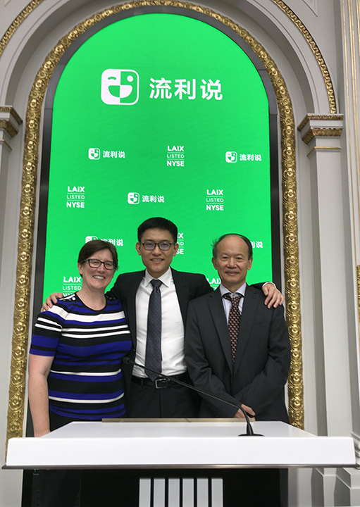 Jennifer Rexford, Yi Wang, and Kai Li standing together at the New York Stock Exchange
