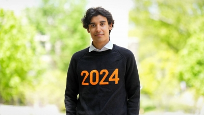 Fernando Aviles-Garcia standing outside wearing a 2024 sweater