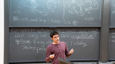 Matt Weinberg at a blackboard, teaching