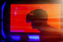 Silhouette of a person wearing a VR headset.