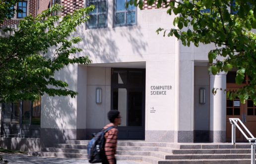 CS Building with student walking in front
