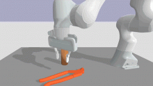 A robot arm picking up a tool