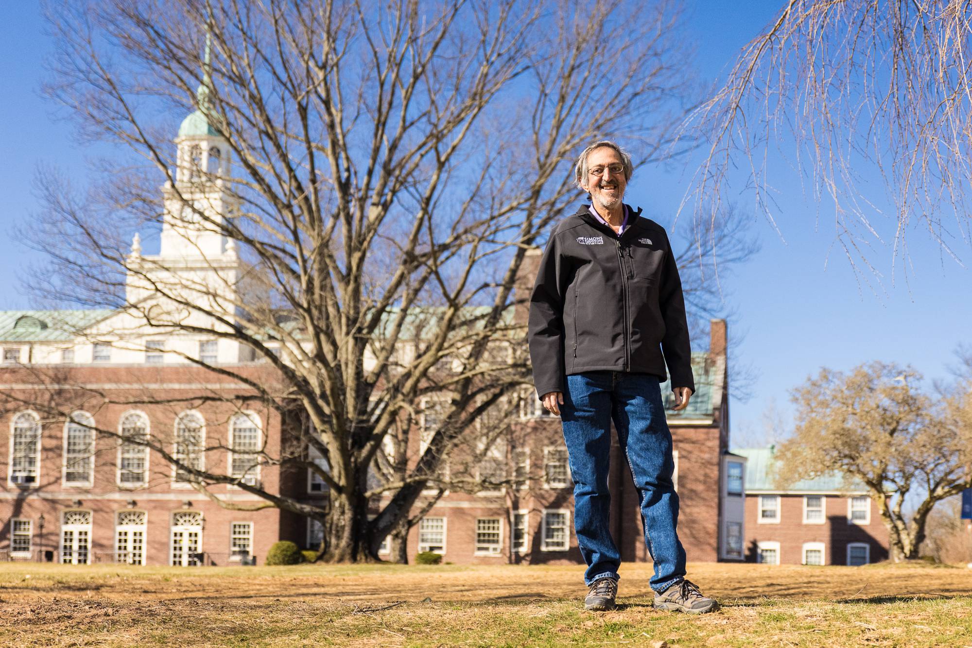 Avi Wigderson standing outside of the Institute for Advanced Study